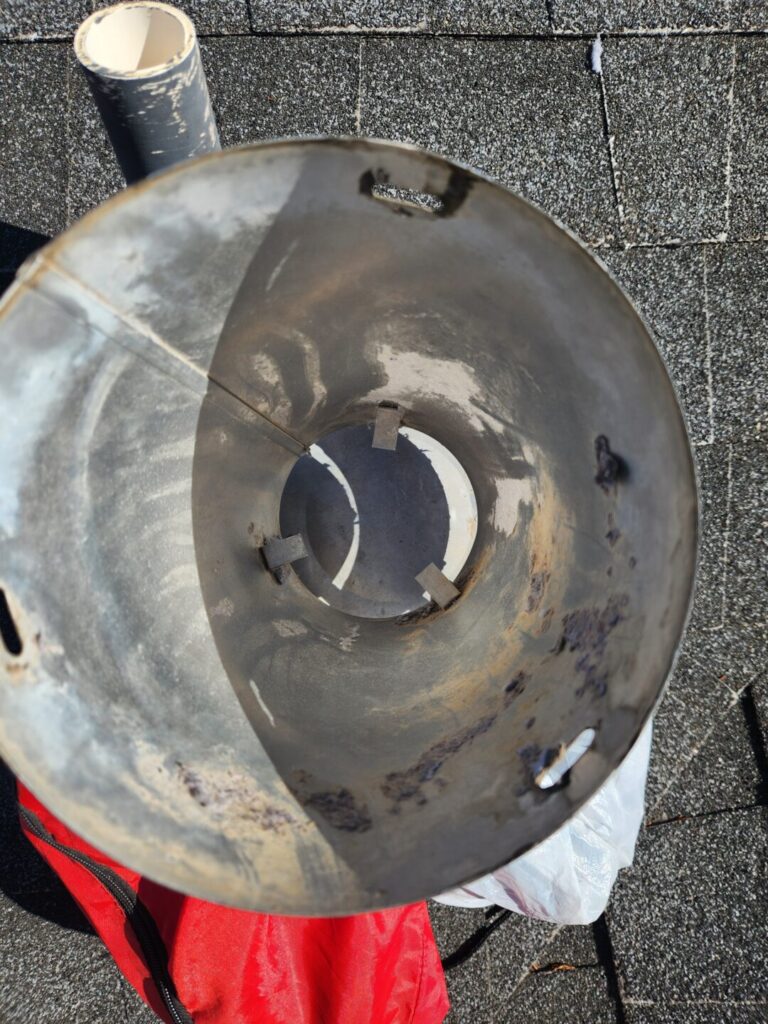 Inside of a dryer roof vent cap after lint was removed during a Chico service call