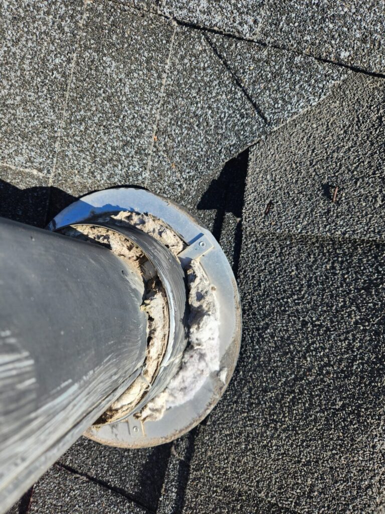 Lint buildup clogging the outside of a dryer roof vent during a Chico service call