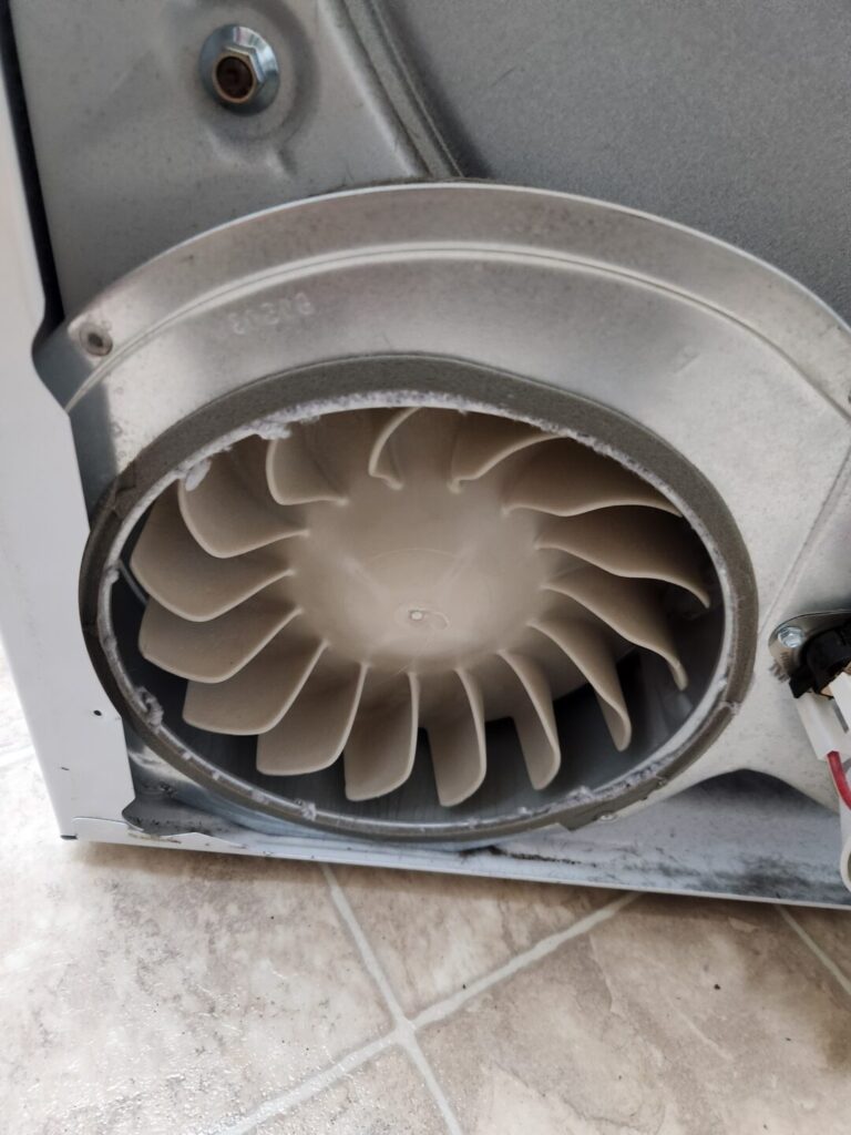 Dryer fan cleaning for top filter models