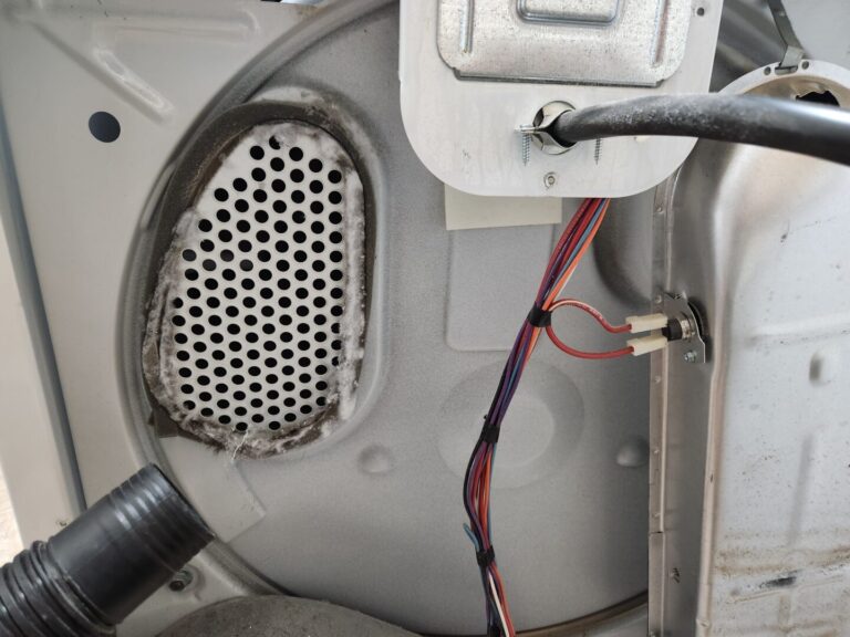 Lint build up around heated air intake of a dryer