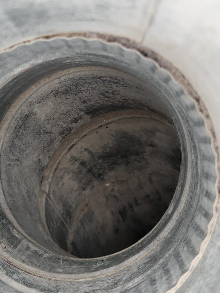 Dryer roof vent duct after lint was removed